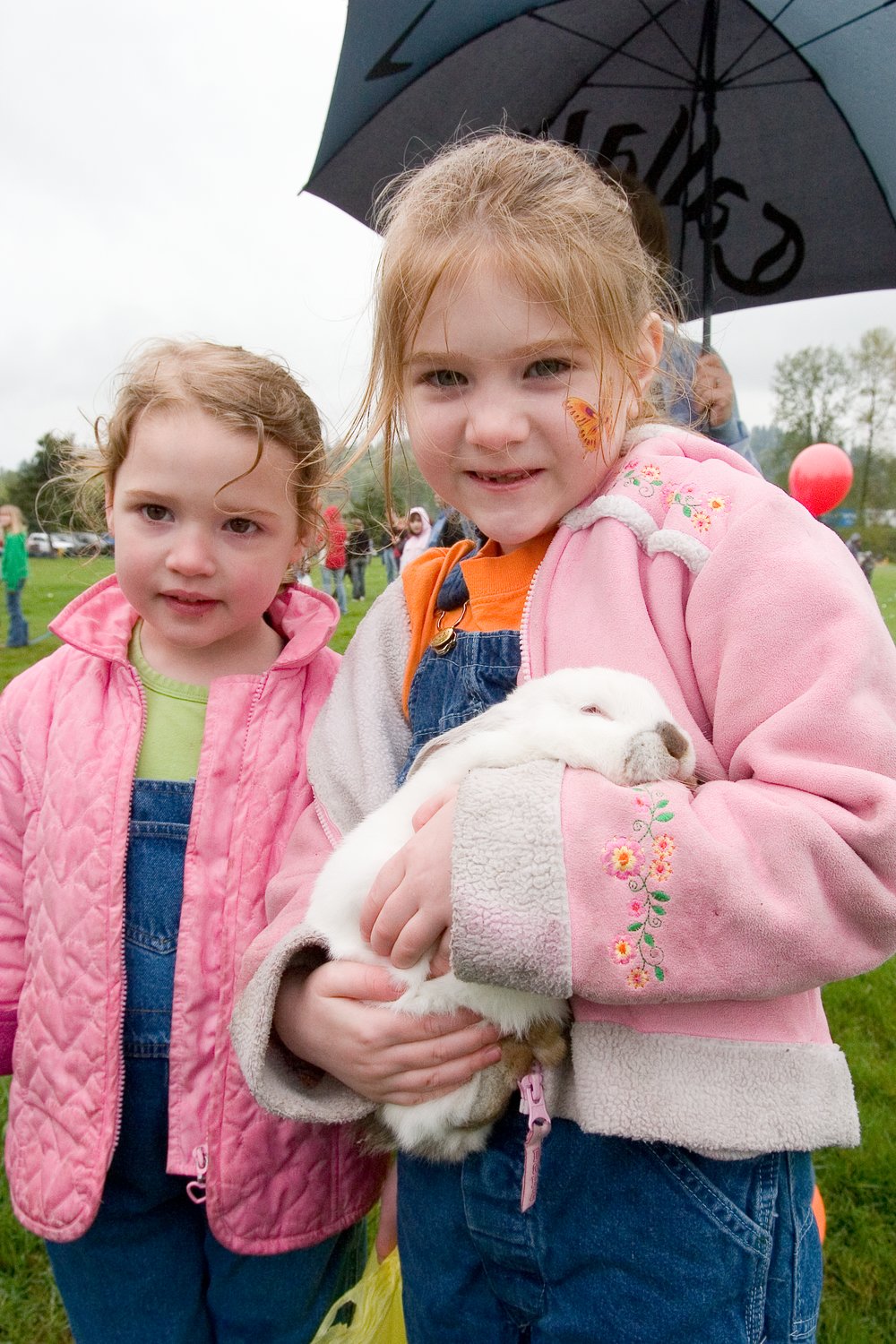 Two girls hold a bunny at a prior Easter celebration. Various events are scheduled to celebrate the holiday throughout North Clark County.
